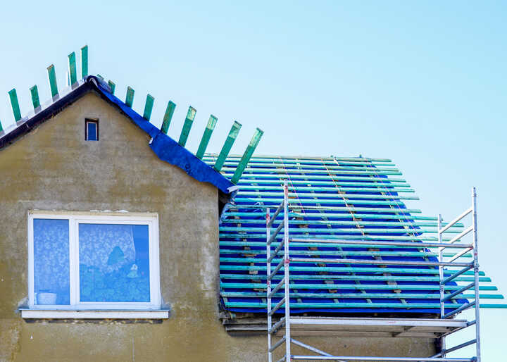 blue roofing battens with scaffolding